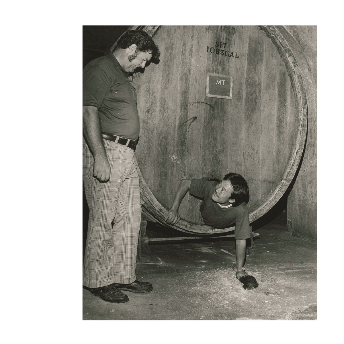 Jim Held with first Intern Cleaning out wine barrels