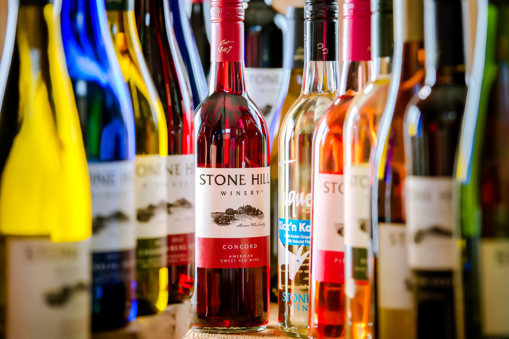 stone hill winery wine bottle line up concord