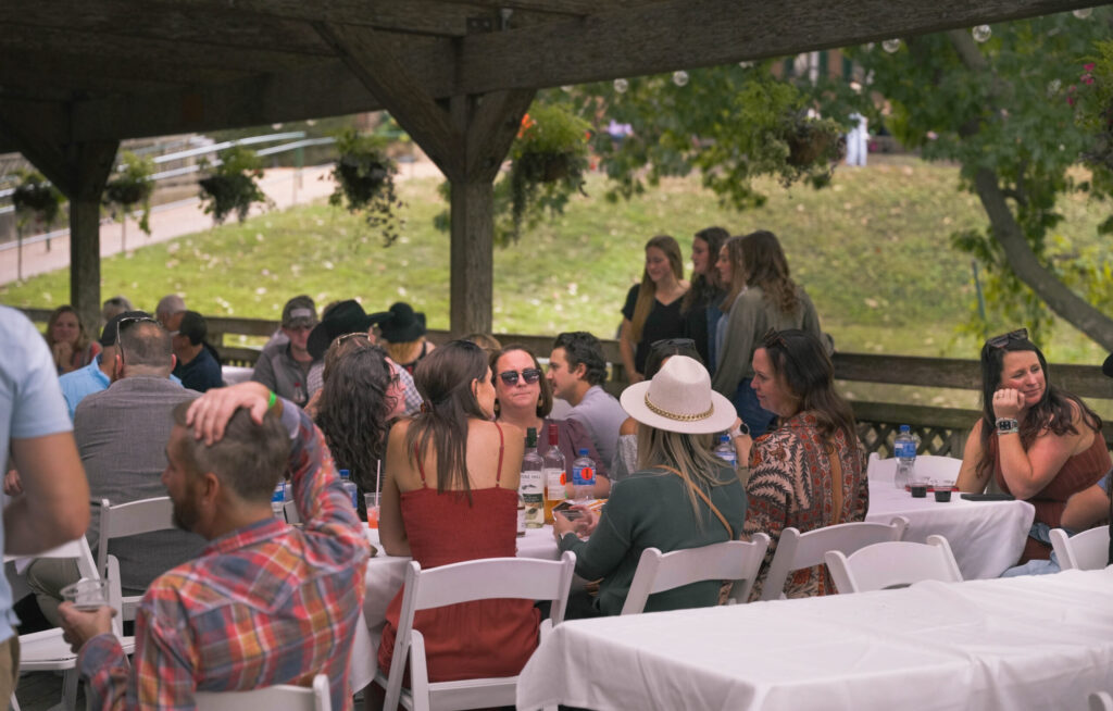 Guests at tables on the Sherry House Pavilion deck
