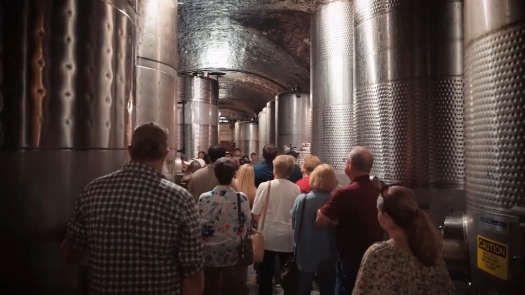 Guests touring the stainless steel tank room on the Behind the Scenes Tour