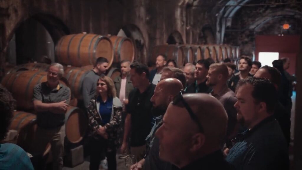 Tour group in the arched underground cellars at Stone Hill